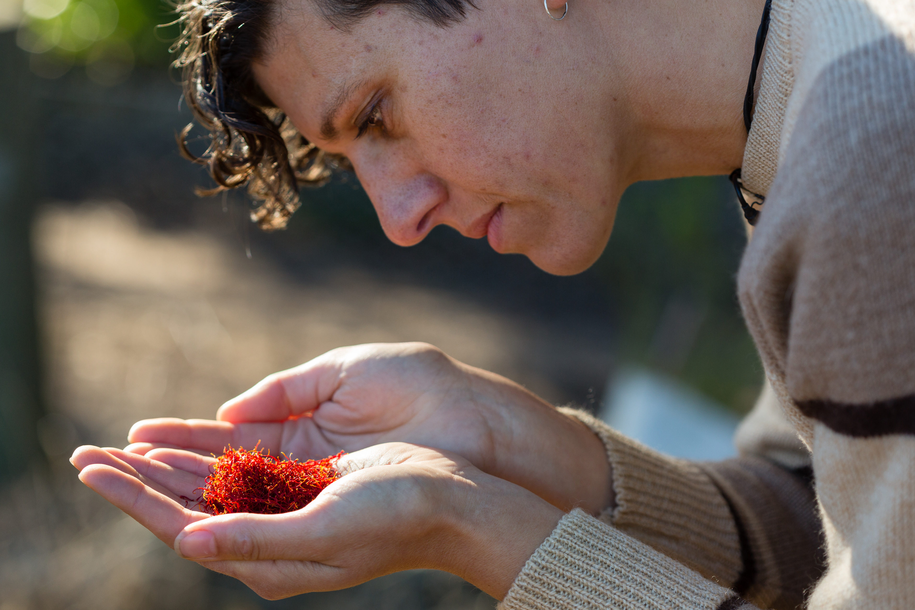 Close up of Gamila with saffron strands in palm