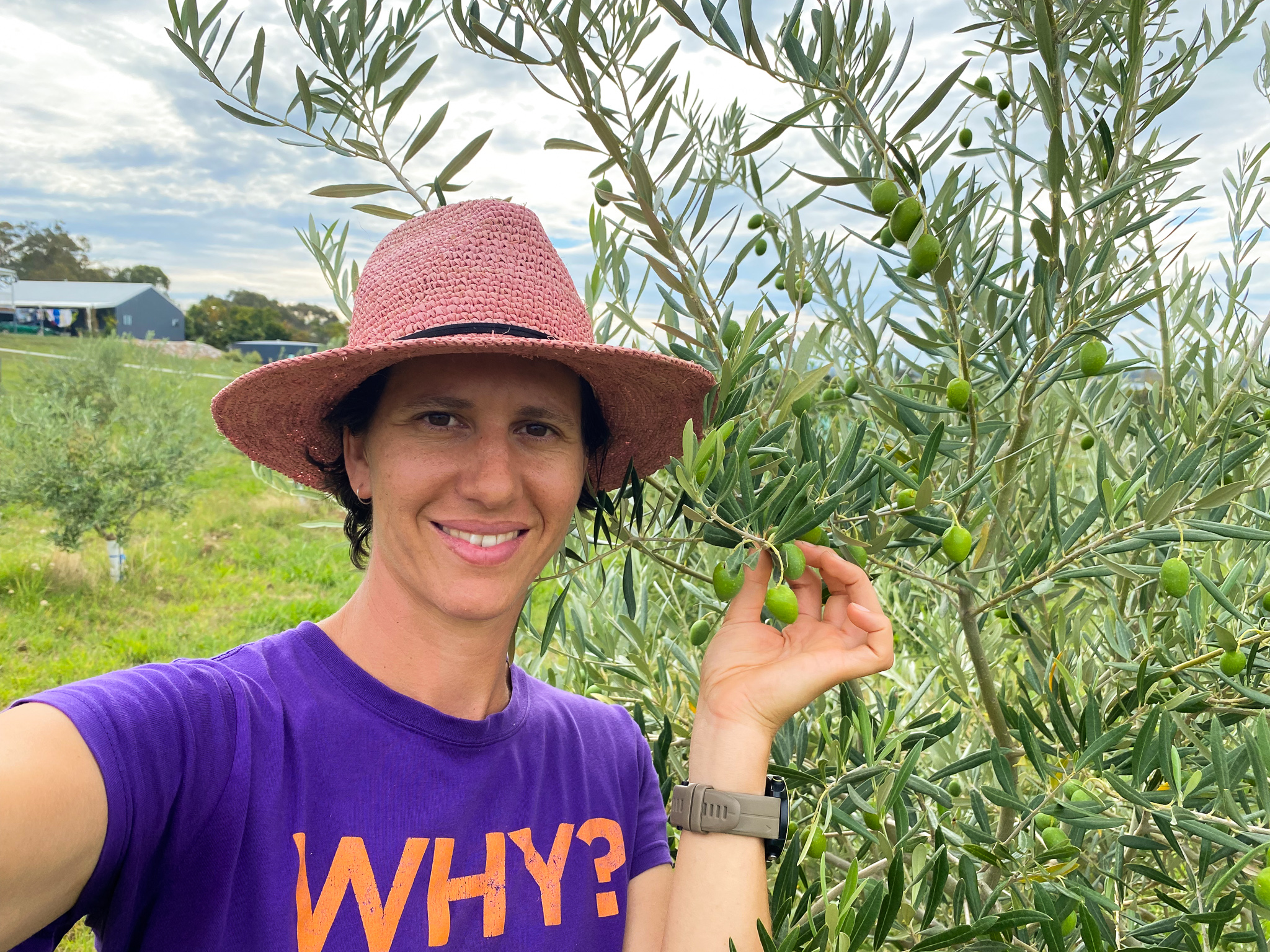 Gamila in front of an olive tree